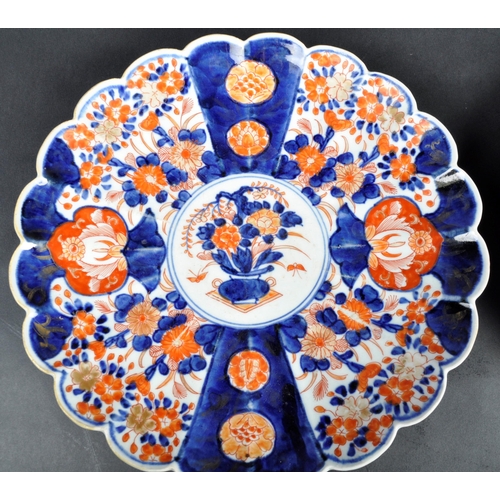 126 - A pair of 19th Century Japanese Meiji period Imari chargers of fluted form. Both with hand painted r... 