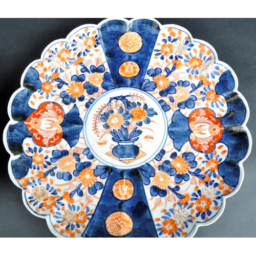 126 - A pair of 19th Century Japanese Meiji period Imari chargers of fluted form. Both with hand painted r... 