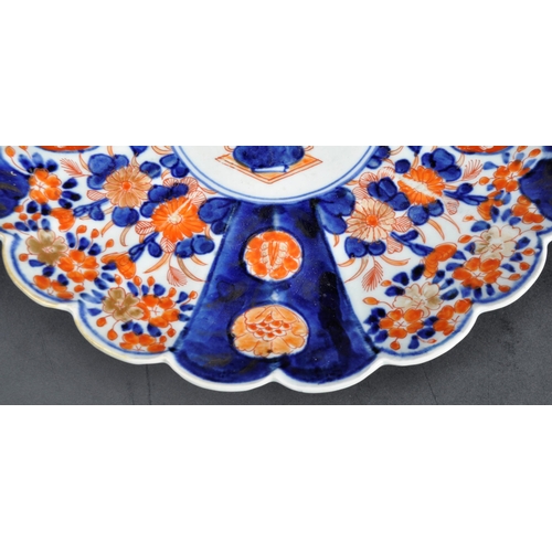 126 - A pair of 19th Century Japanese Meiji period Imari chargers of fluted form. Both with hand painted r... 