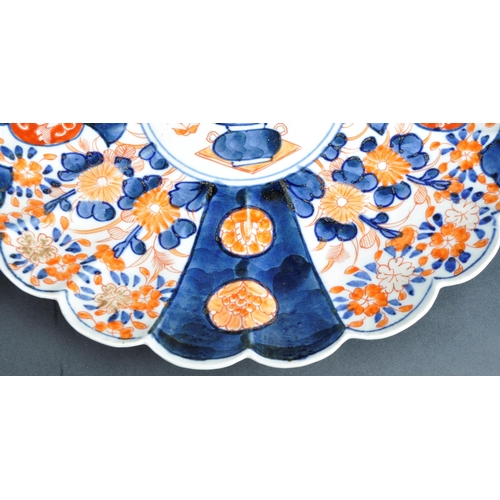 126 - A pair of 19th Century Japanese Meiji period Imari chargers of fluted form. Both with hand painted r... 