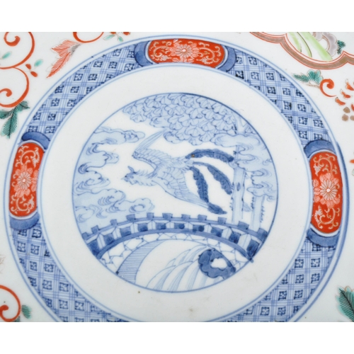 127 - A large 19th Century Chinese / Japanese Imari charger plate. Central hand painted medallion featurin... 