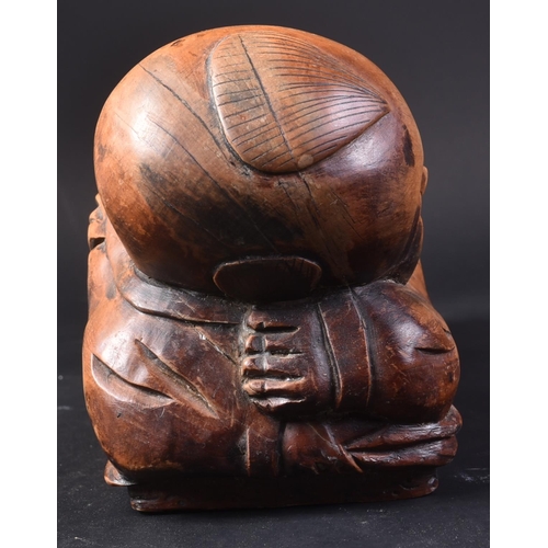 128 - A 20th Century Chinese hand carved headrest pillow in the form of a sleeping child. Detailed carved ... 