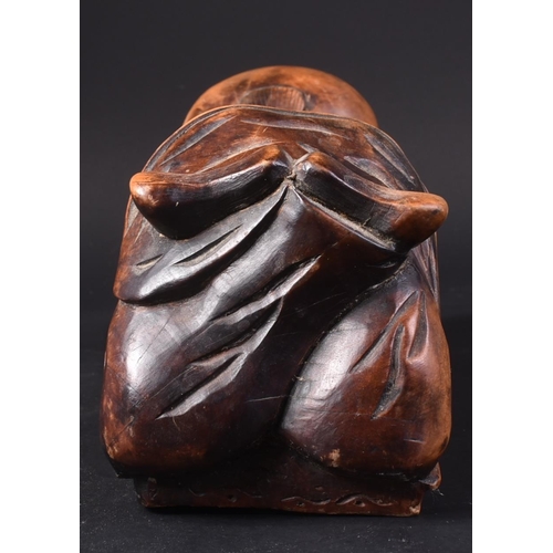 128 - A 20th Century Chinese hand carved headrest pillow in the form of a sleeping child. Detailed carved ... 