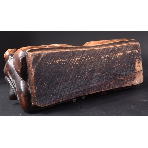 128 - A 20th Century Chinese hand carved headrest pillow in the form of a sleeping child. Detailed carved ... 