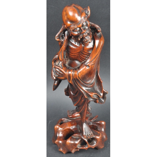 131 - A large 19th Century Chinese hand carved figurine depicting an emaciated elder immortal figurine / L... 