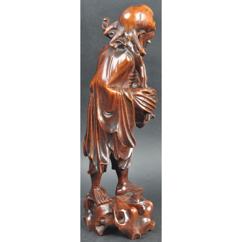 131 - A large 19th Century Chinese hand carved figurine depicting an emaciated elder immortal figurine / L... 