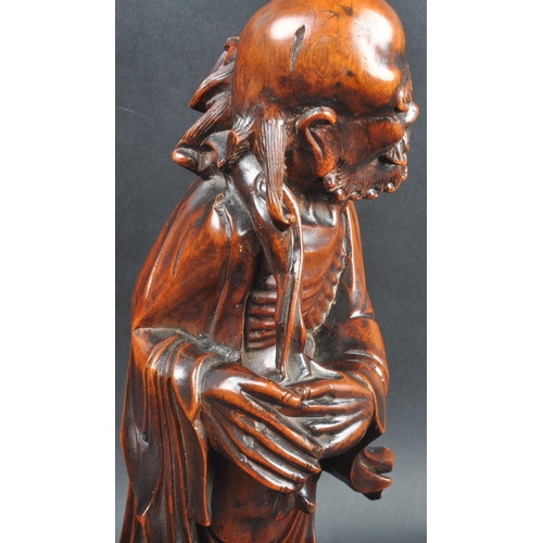 131 - A large 19th Century Chinese hand carved figurine depicting an emaciated elder immortal figurine / L... 
