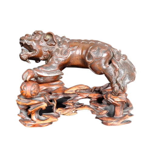 133 - An 18th Century Chinese bronze Foo Dog. The figure modelled standing with detailed features, open ja... 