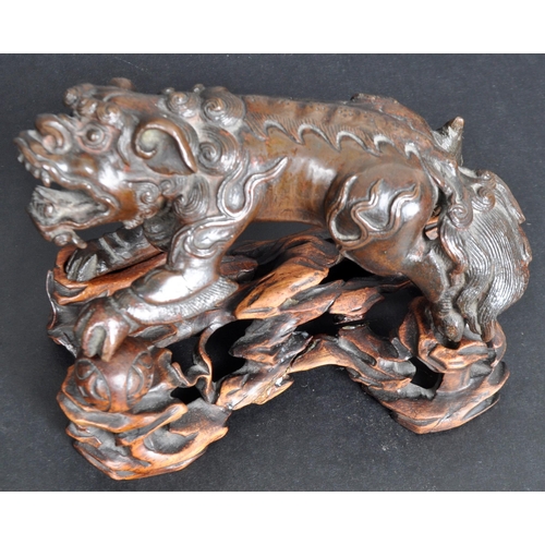 133 - An 18th Century Chinese bronze Foo Dog. The figure modelled standing with detailed features, open ja... 