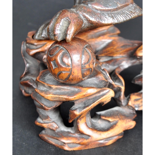 133 - An 18th Century Chinese bronze Foo Dog. The figure modelled standing with detailed features, open ja... 