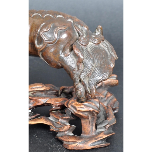 133 - An 18th Century Chinese bronze Foo Dog. The figure modelled standing with detailed features, open ja... 