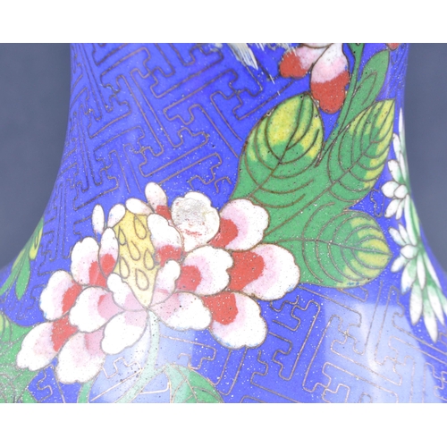 135 - A pair of early 20th Century Chinese Cloisonne vases. Baluster form with polychrome enamel decoratio... 