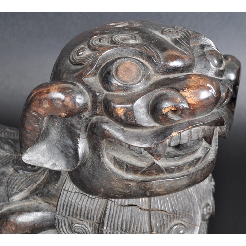137 - A large pair of 19th Century Chinese hand carved hardwood foo dogs / temple lions. Elongated form wi... 