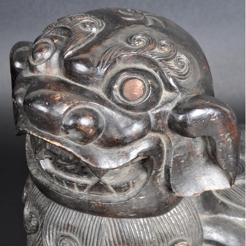 137 - A large pair of 19th Century Chinese hand carved hardwood foo dogs / temple lions. Elongated form wi... 