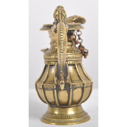 140 - A 19th century Nepalese ritual butter lamp – Sukunda. Cast and chiselled bronze of baluster form and... 