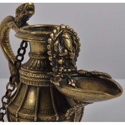 140 - A 19th century Nepalese ritual butter lamp – Sukunda. Cast and chiselled bronze of baluster form and... 
