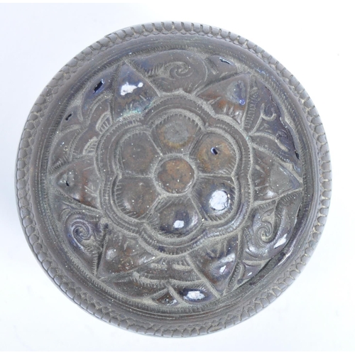 141 - A large Indonesian cast brass lime container. A spherical brass box, cast in two halves, decorated i... 