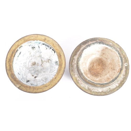 141 - A large Indonesian cast brass lime container. A spherical brass box, cast in two halves, decorated i... 