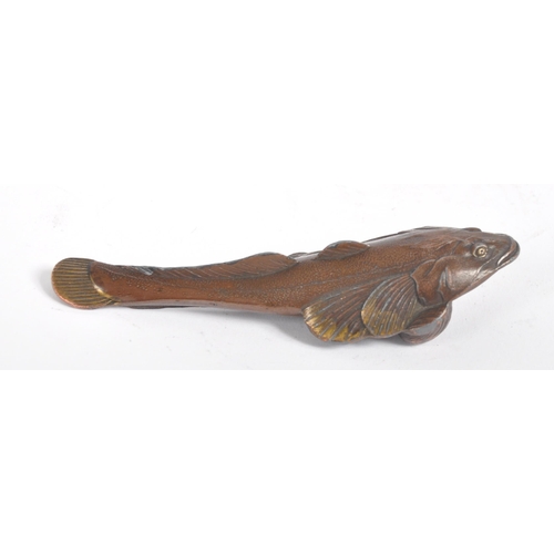 145 - An early 20th century Japanese bronze scroll weight. A Meiji period bronze in the form of a carp wit... 