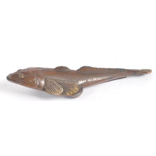 145 - An early 20th century Japanese bronze scroll weight. A Meiji period bronze in the form of a carp wit... 