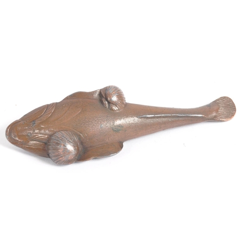 145 - An early 20th century Japanese bronze scroll weight. A Meiji period bronze in the form of a carp wit... 