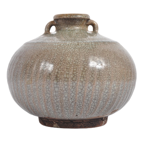 146 - A 15th century Chinese Ming dynasty celadon jar / jug. With short everted neck and twin lug handles ... 