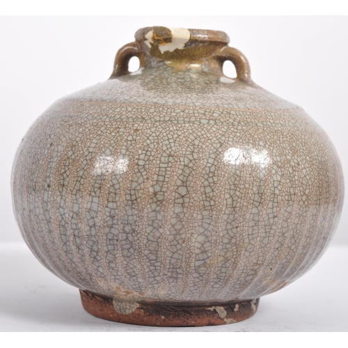 146 - A 15th century Chinese Ming dynasty celadon jar / jug. With short everted neck and twin lug handles ... 