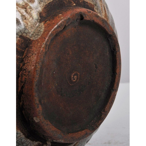 146 - A 15th century Chinese Ming dynasty celadon jar / jug. With short everted neck and twin lug handles ... 