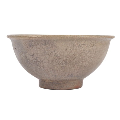 147 - A 15th century Chinese Ming Dynasty celadon bowl. With raised lips on a circular foot, with crackled... 