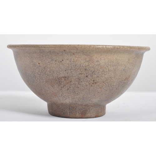 147 - A 15th century Chinese Ming Dynasty celadon bowl. With raised lips on a circular foot, with crackled... 