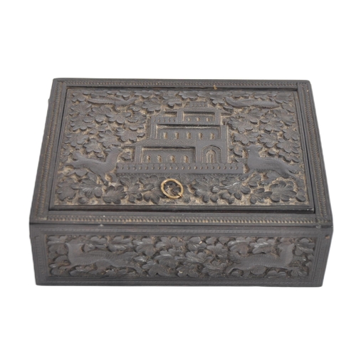 148 - A 19th century Anglo Indian hand carved wooden trinket Box. Black hardwood of square form intricatel... 