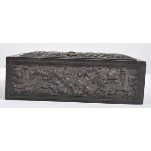 148 - A 19th century Anglo Indian hand carved wooden trinket Box. Black hardwood of square form intricatel... 