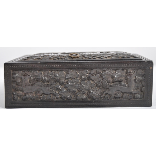 148 - A 19th century Anglo Indian hand carved wooden trinket Box. Black hardwood of square form intricatel... 