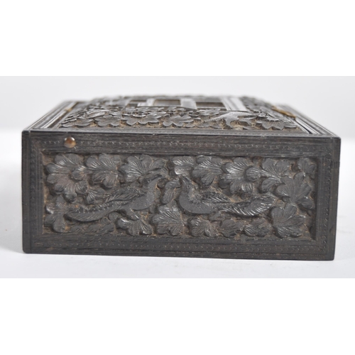 148 - A 19th century Anglo Indian hand carved wooden trinket Box. Black hardwood of square form intricatel... 