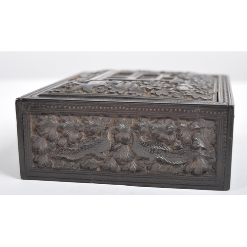 148 - A 19th century Anglo Indian hand carved wooden trinket Box. Black hardwood of square form intricatel... 