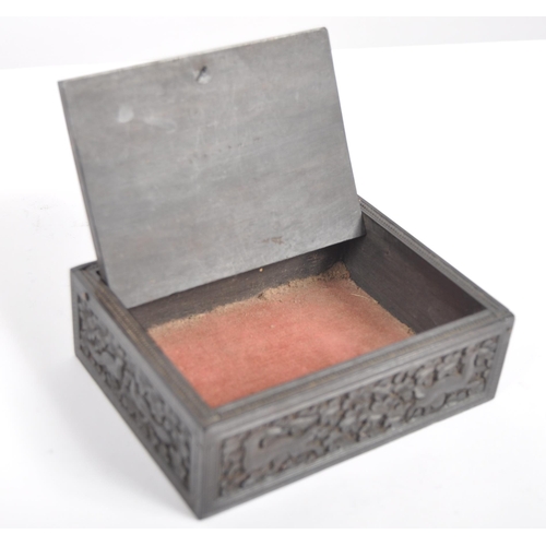 148 - A 19th century Anglo Indian hand carved wooden trinket Box. Black hardwood of square form intricatel... 