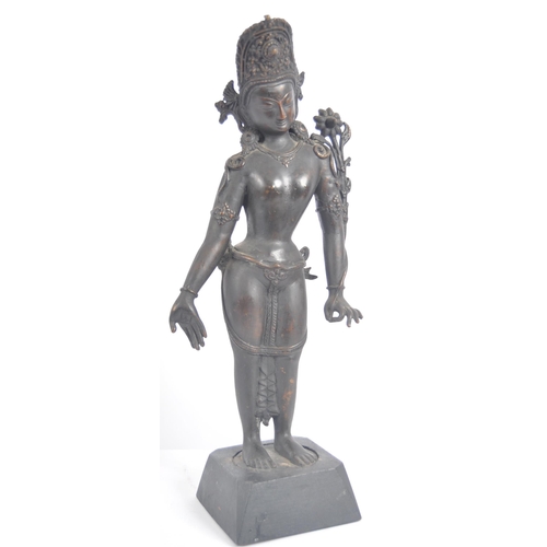 149 - An early 20th century Thai / Chinese bronze deity. A standing female figure with arms stretched out,... 