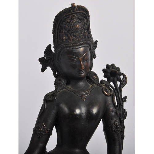 149 - An early 20th century Thai / Chinese bronze deity. A standing female figure with arms stretched out,... 