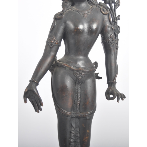 149 - An early 20th century Thai / Chinese bronze deity. A standing female figure with arms stretched out,... 