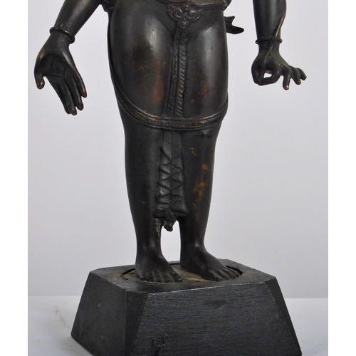 149 - An early 20th century Thai / Chinese bronze deity. A standing female figure with arms stretched out,... 