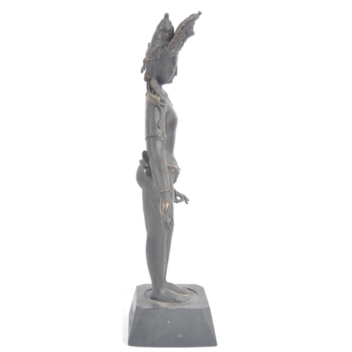 149 - An early 20th century Thai / Chinese bronze deity. A standing female figure with arms stretched out,... 