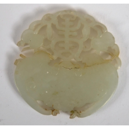 150 - A 19th Century Chinese antique hand carved jade panel depicting a bat and peaches with pierced detai... 