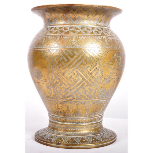 154 - An 18th Century Persian heavy bronze centrepiece vase having a flared rim with bulbous body and flar... 