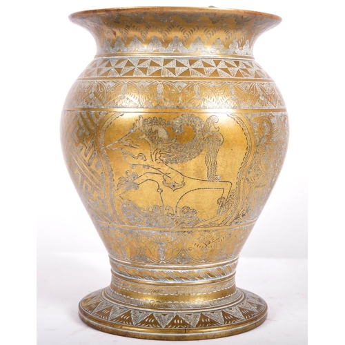 154 - An 18th Century Persian heavy bronze centrepiece vase having a flared rim with bulbous body and flar... 