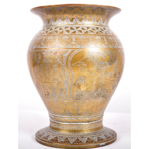 154 - An 18th Century Persian heavy bronze centrepiece vase having a flared rim with bulbous body and flar... 