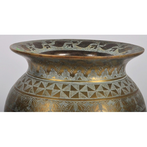 154 - An 18th Century Persian heavy bronze centrepiece vase having a flared rim with bulbous body and flar... 