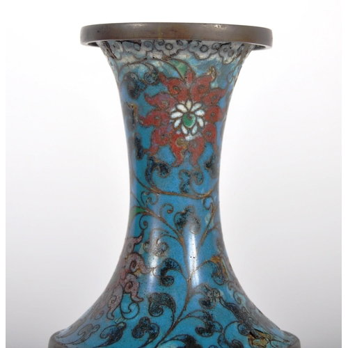 155 - An early 20th Century Chinese Cloisonne vase of baluster form. Blue ground with scrolling flowers th... 