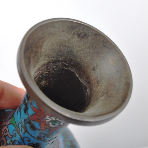 155 - An early 20th Century Chinese Cloisonne vase of baluster form. Blue ground with scrolling flowers th... 