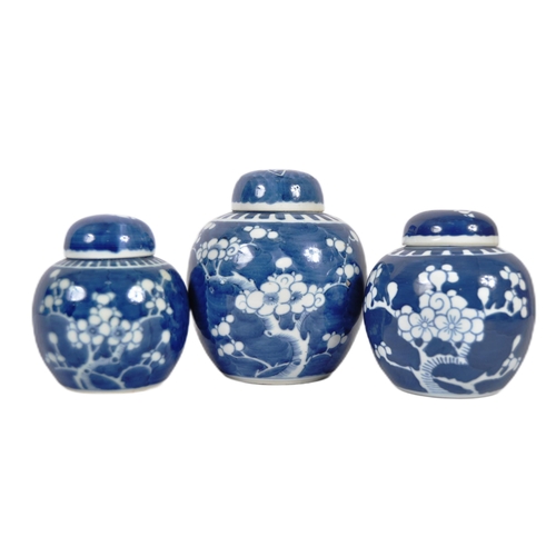 156 - A trio of early 20th Century Chinese porcelain blue & white ginger jars. Cobalt blue ground with whi... 