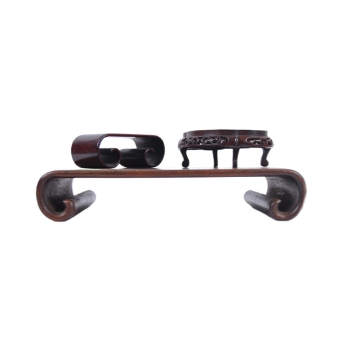 16 - A group of three Chinese carved hardwood stand dating from the 19th Century to include a large stand... 